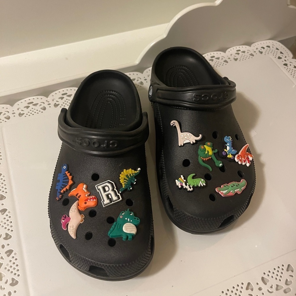 Croc black, new conditions with charms for men women or youth boys or girls